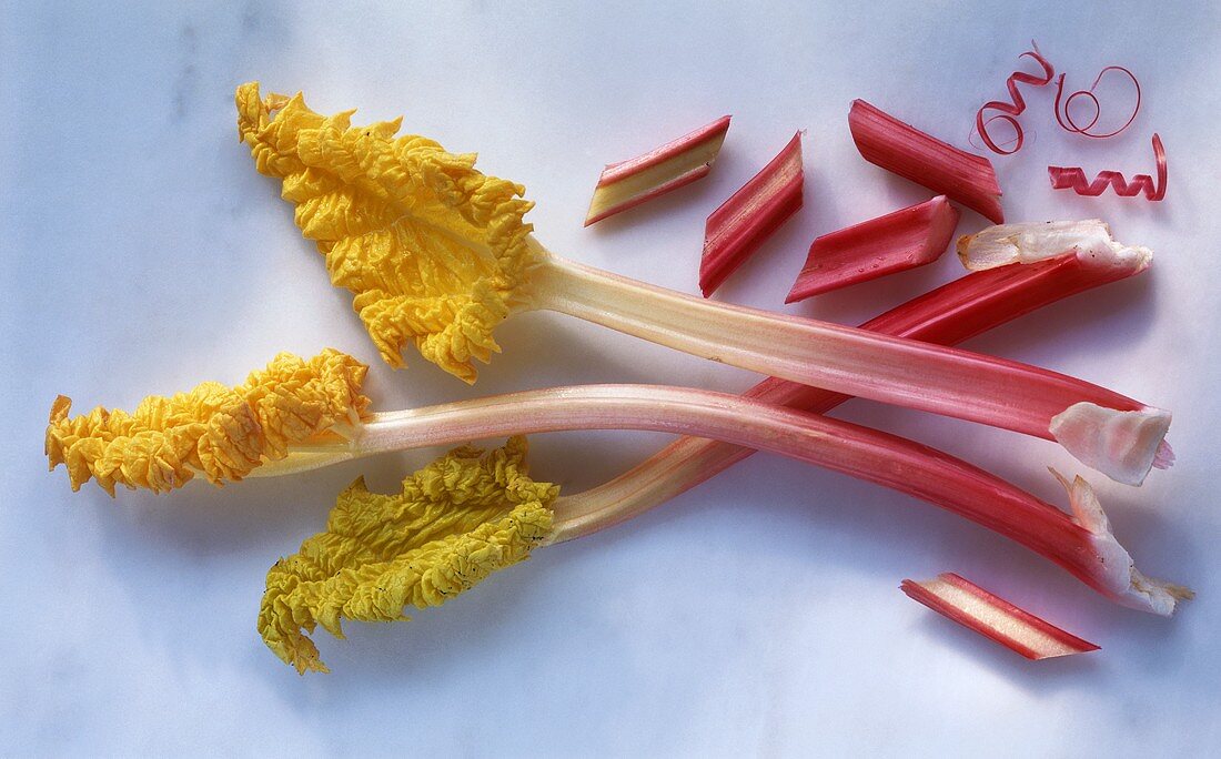 Whole sticks of rhubarb with leaves & pieces of rhubarb