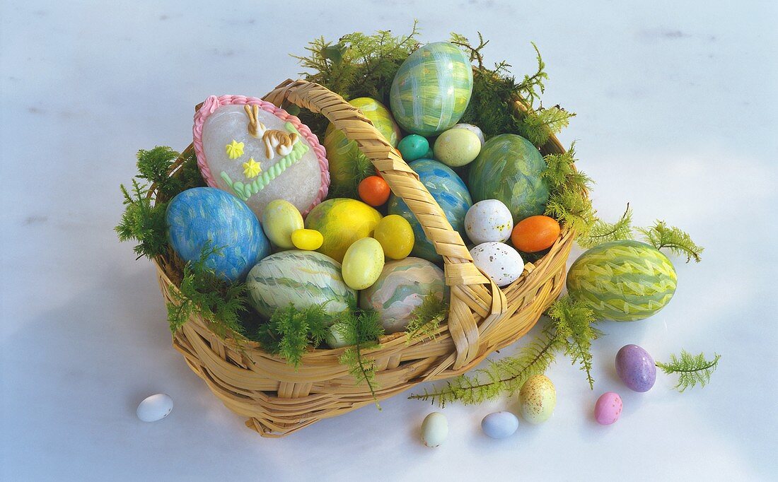 Various coloured Easter eggs in basket