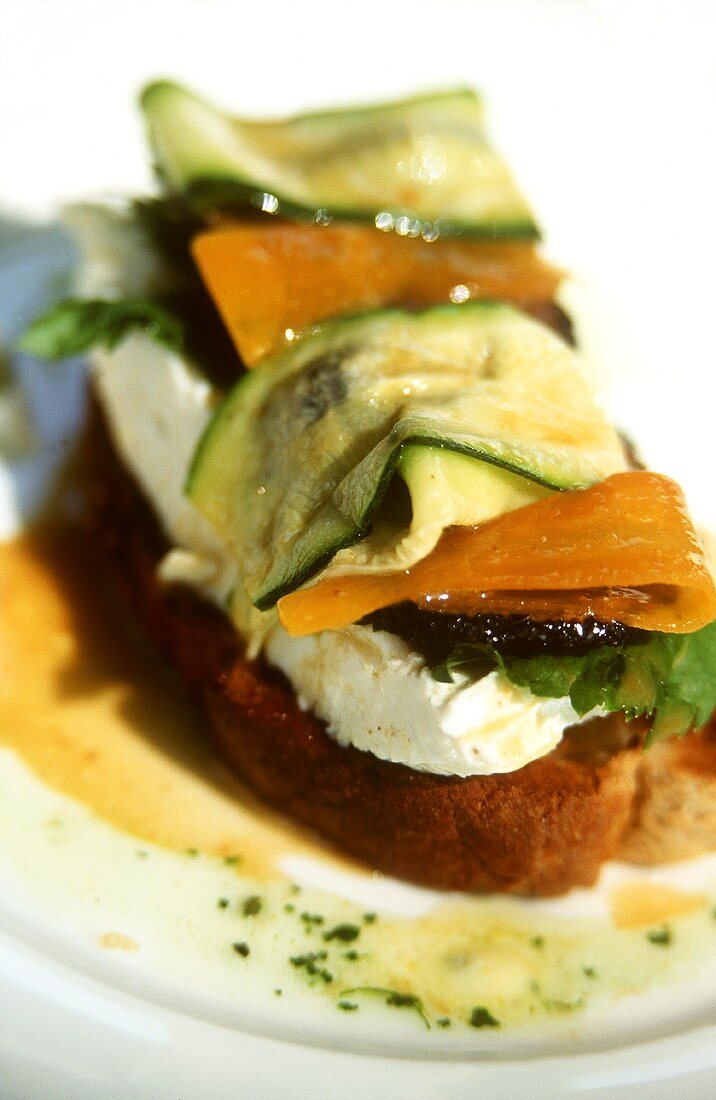 Crostini topped with cheese and courgettes