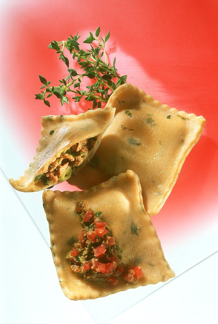 Thyme ravioli with tuna filling and tomato pesto