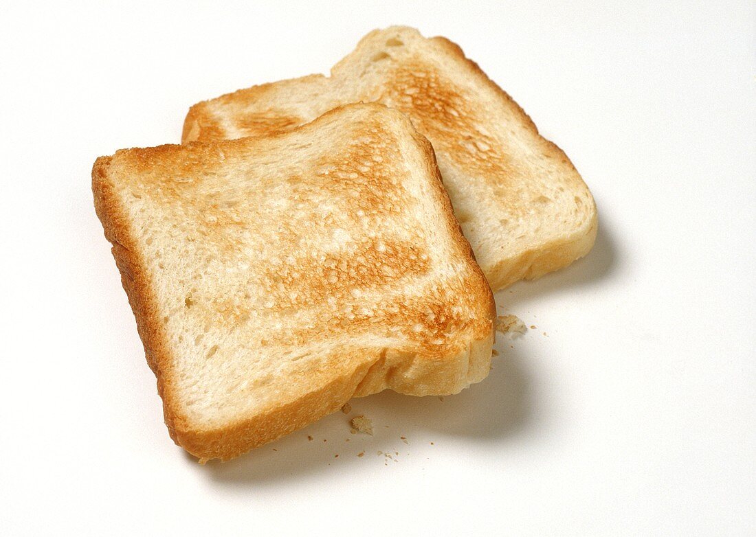 Two slices of toast on a light background