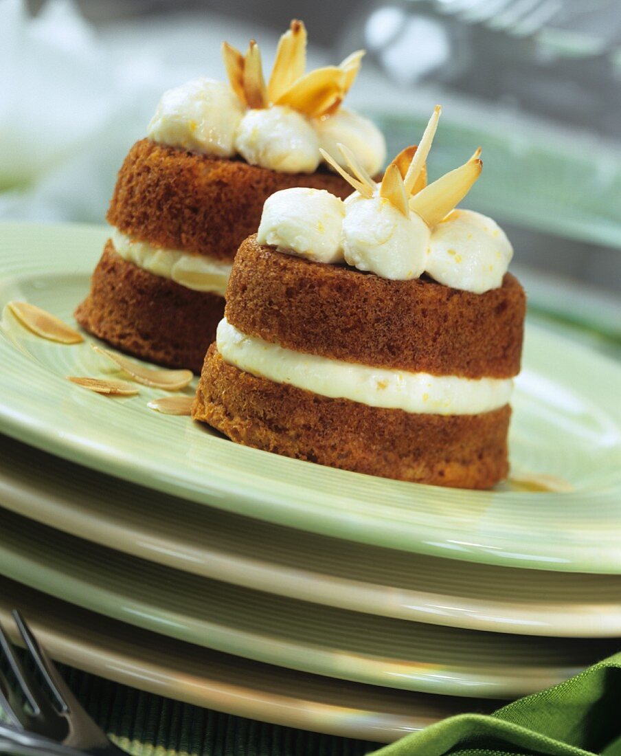 Muffins with cream quark and flaked almonds on plate