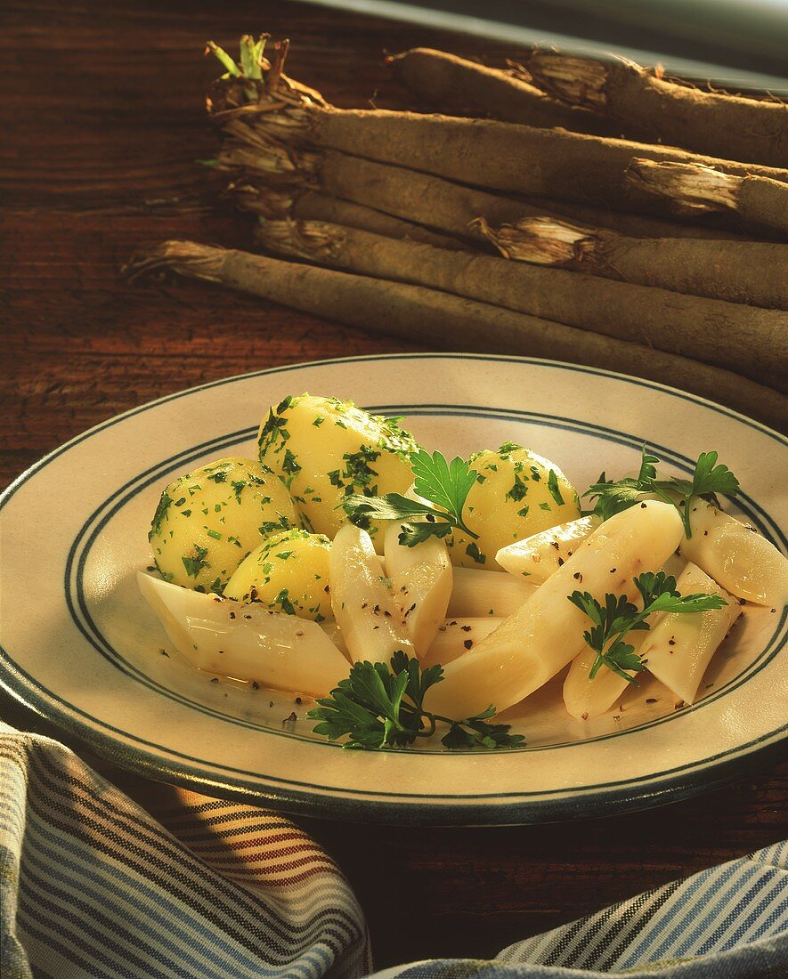 Parsley potatoes with scorzonera on plate