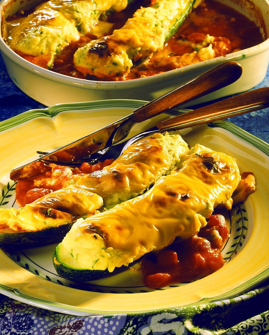 Stuffed courgettes with mashed potato & tomato sauce