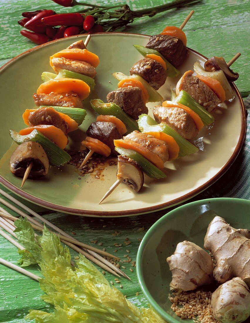 Meat and vegetable kebabs with sesame