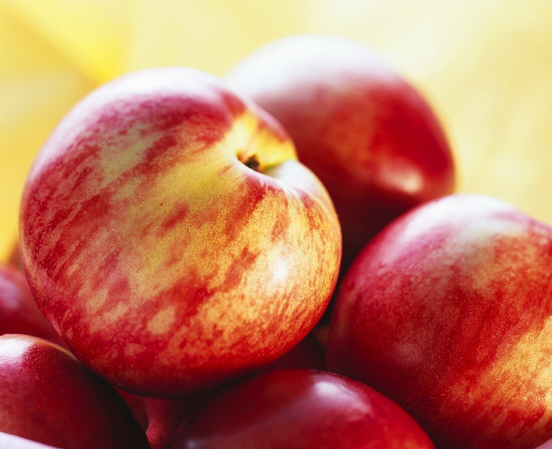 A few nectarines (close-up) against light background