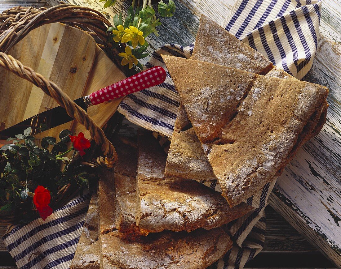 Tyrolean rye bread, cut into triangle, on cloth
