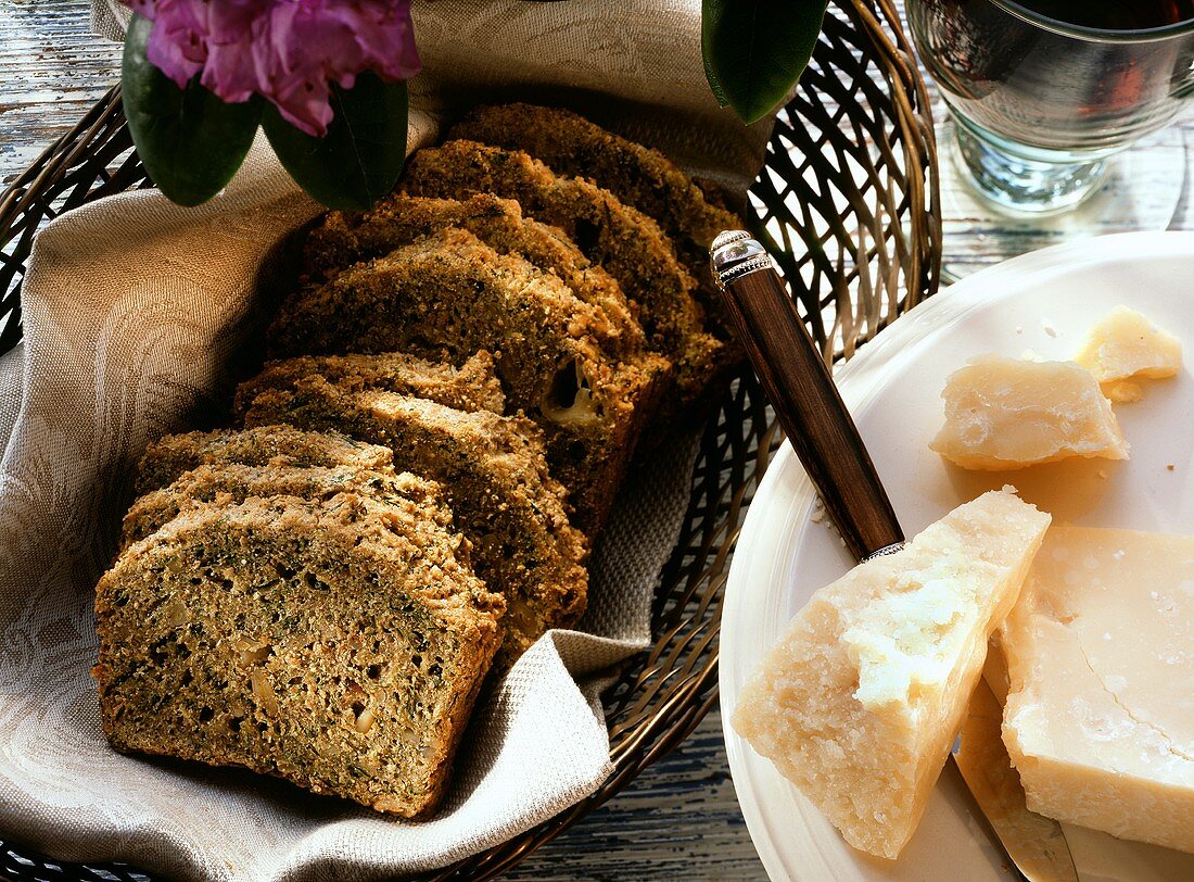Herb bread with parmesan in slices in bread basket