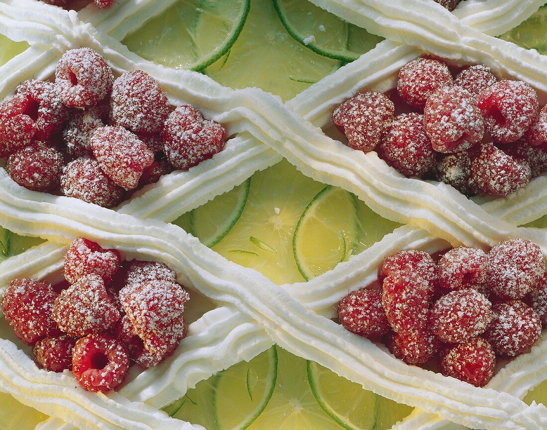 Lime rice gateau (detail) with sugared raspberries, cream