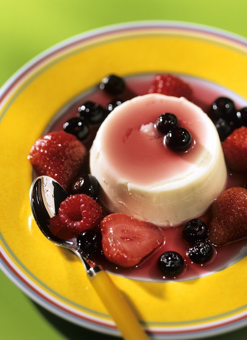 Panna cotta with mixed berries and red wine sauce