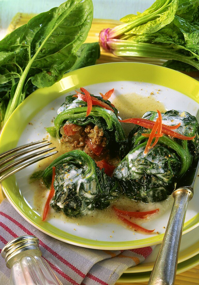 Spinach leaves stuffed with mince and coconut with tomato 