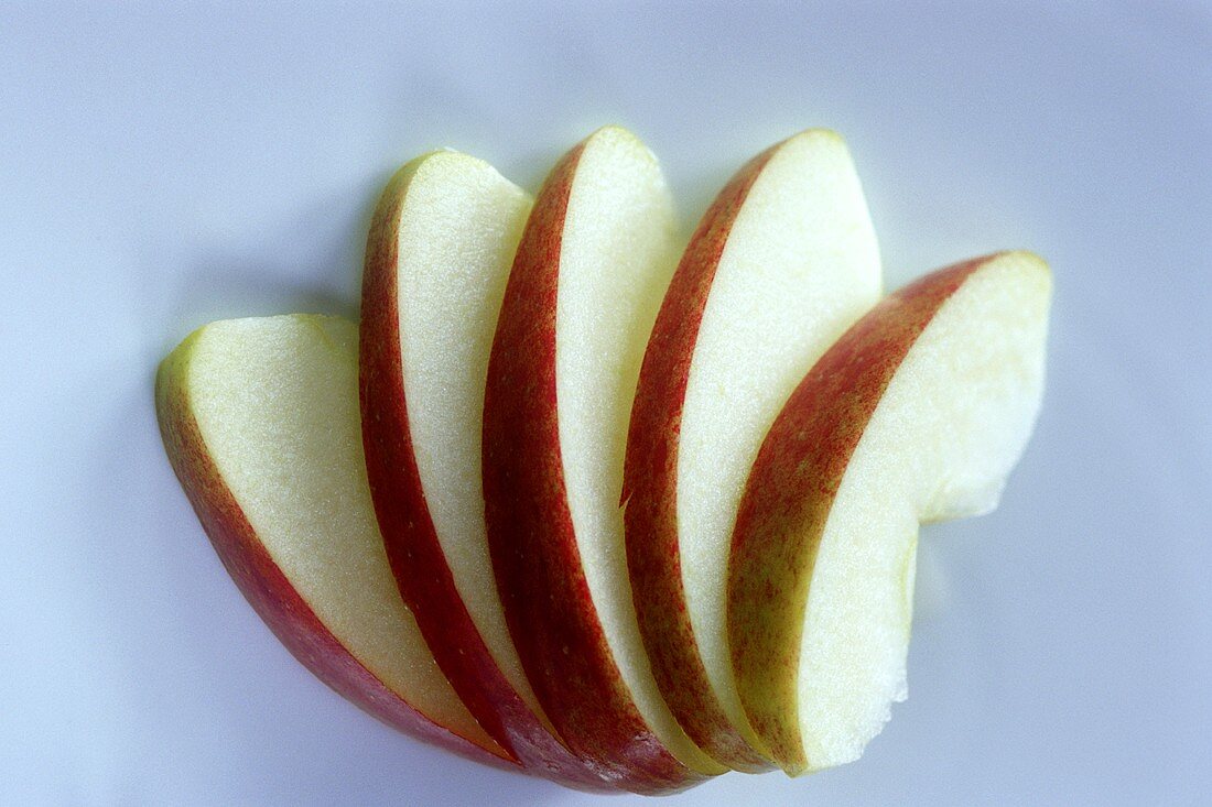 A few apple slices, arranged in a fan