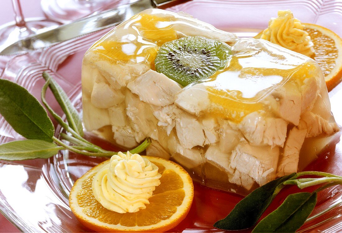 Chicken in aspic with oranges, kiwi fruit and sage