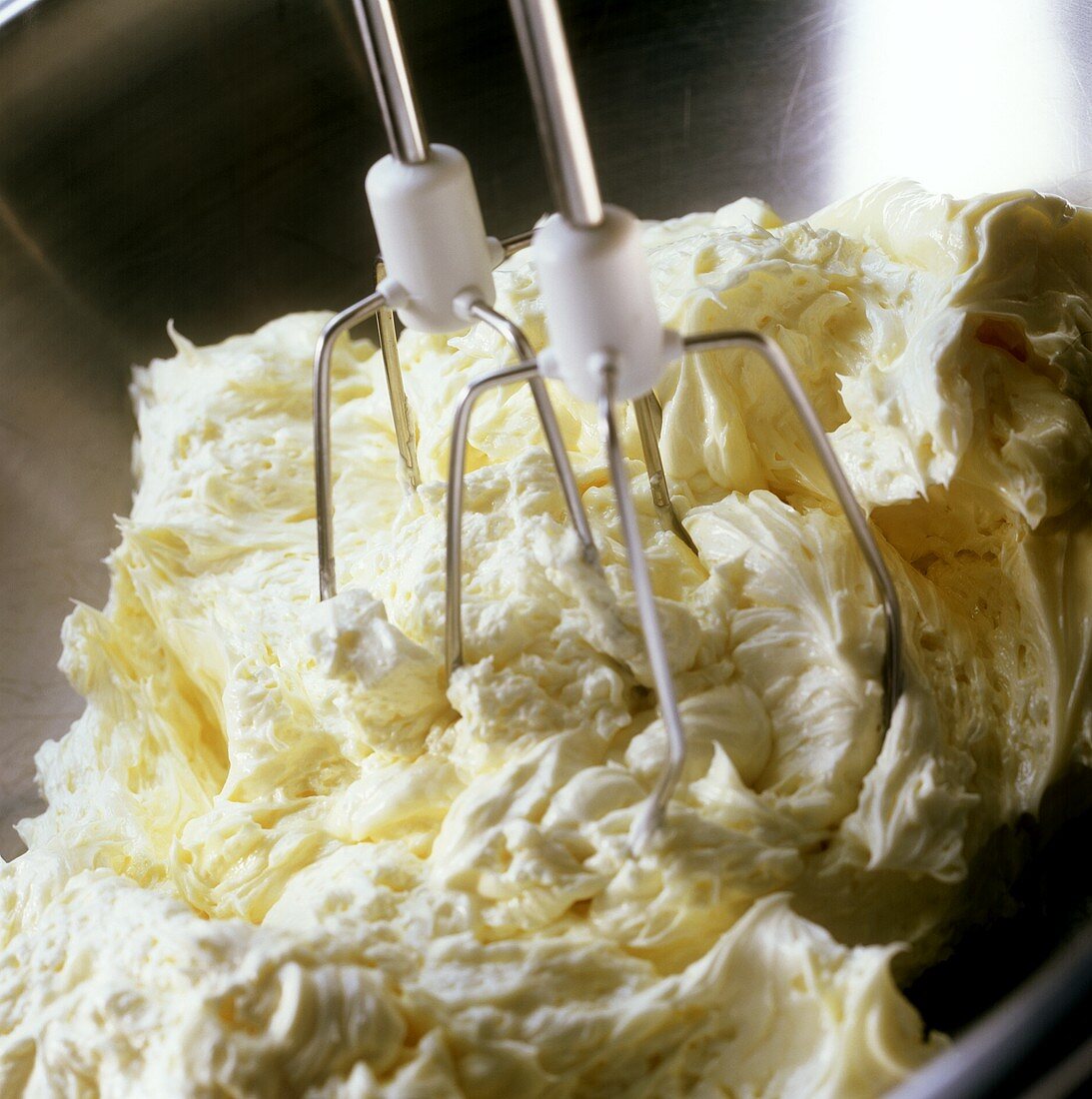 Making creamed cake mixture:creaming butter with hand mixer