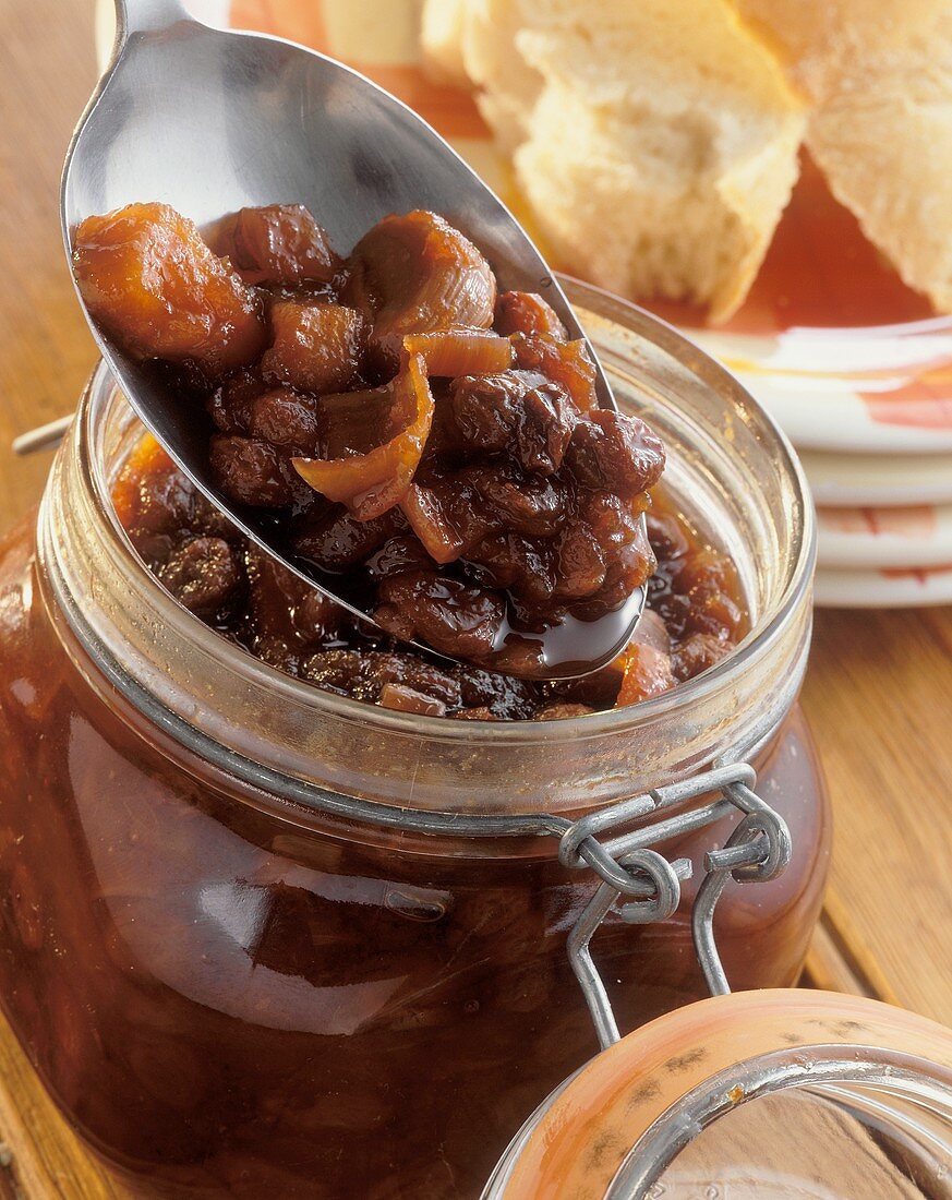 Chutney in a jar and on a spoon above it