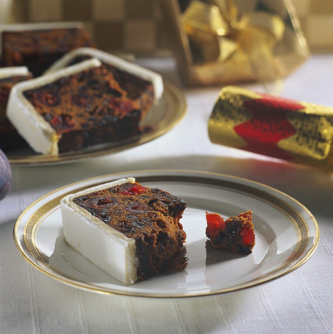 Fruit loaf with white icing on plate, for Christmas