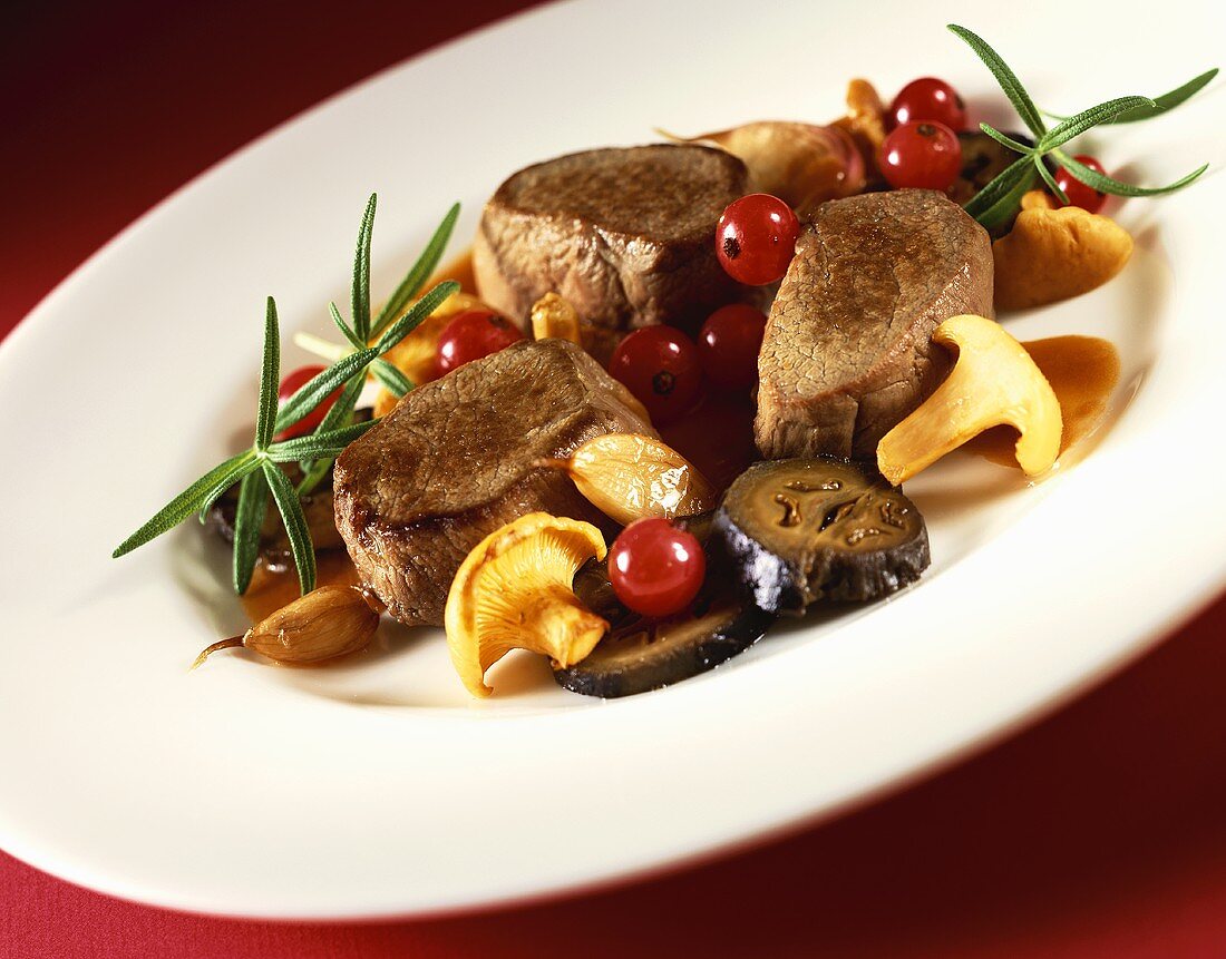 Venison fillets with chanterelles, cranberries & rosemary