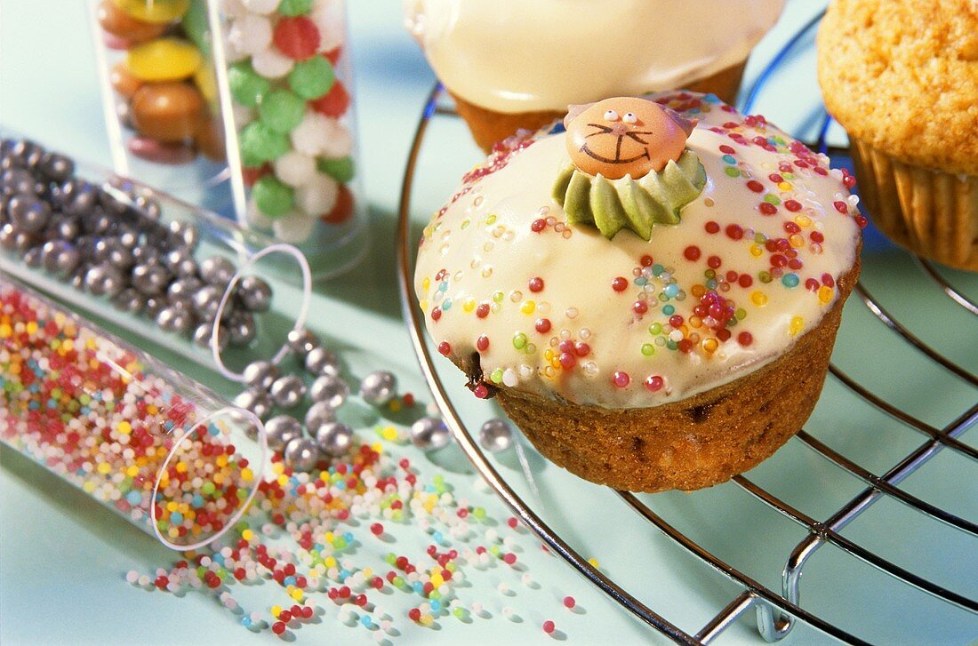 Decorating muffins with sugar pearls and shapes