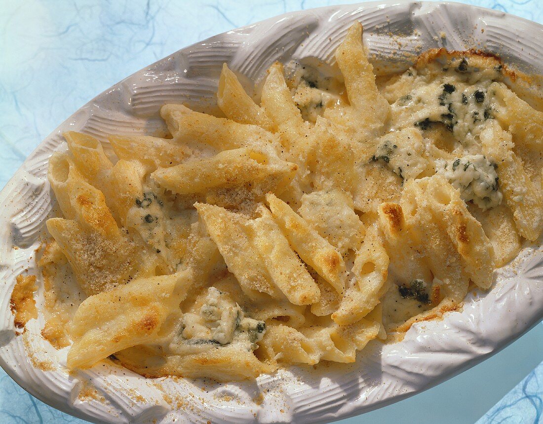 Penne bake with gorgonzola on white platter