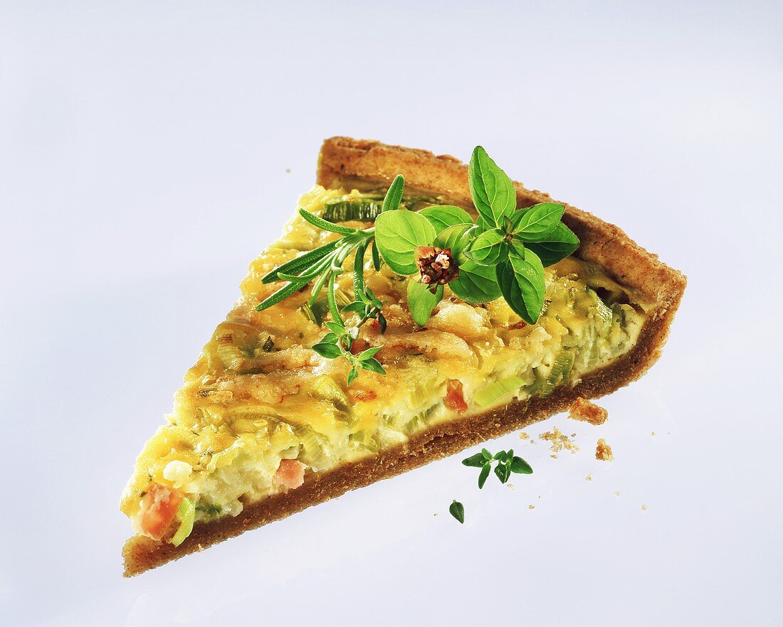 A piece of quiche with leeks and ham