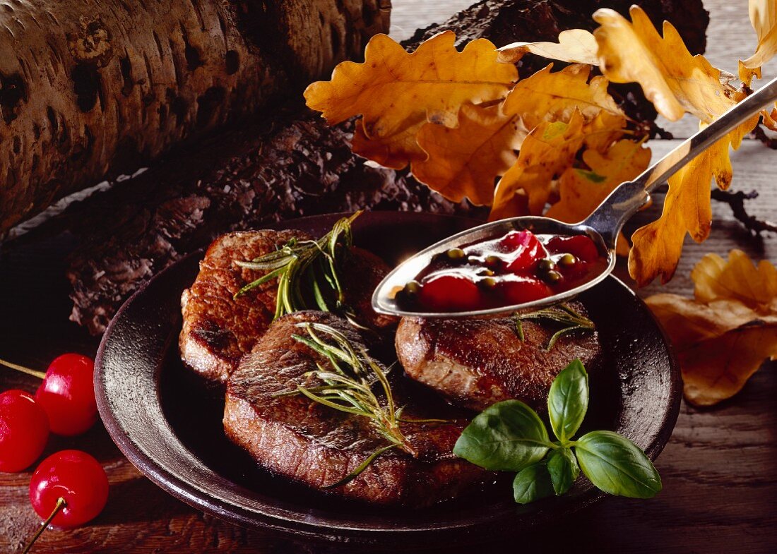 Venison medallions with spicy cherry sauce