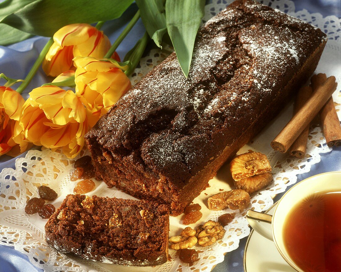 Polish gingerbread with nuts and dried fruit; tea
