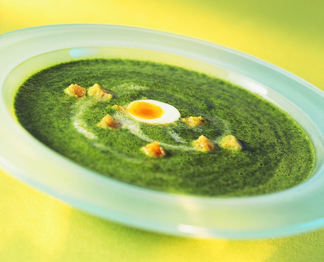 Ramsons (wild garlic) soup with quail's egg and croutons