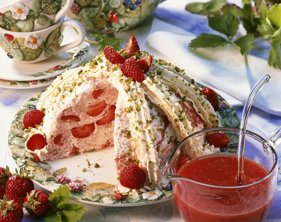 Strawberry rice bombe with cream and chopped pistachios