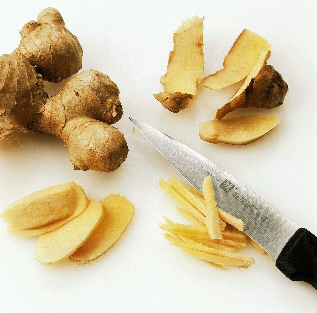 Peeling ginger and cutting into slices and strips
