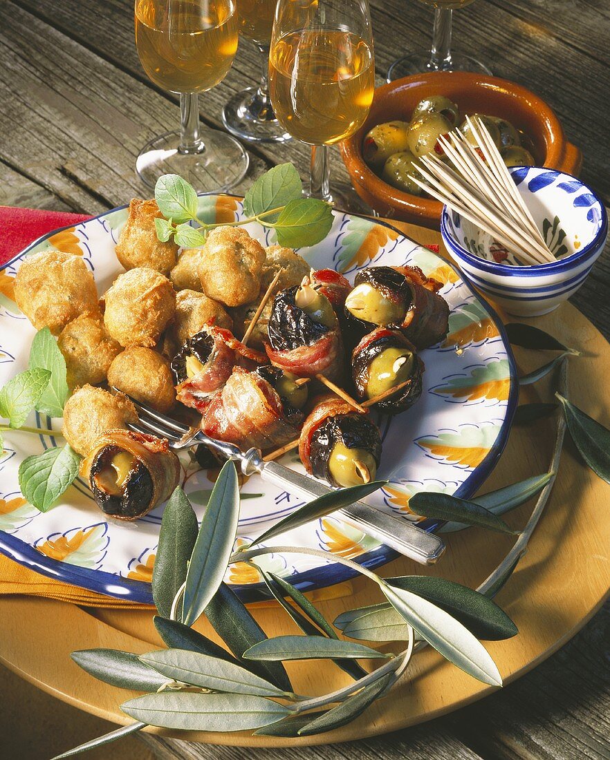 Olive tapas: olives in batter, prunes with olives