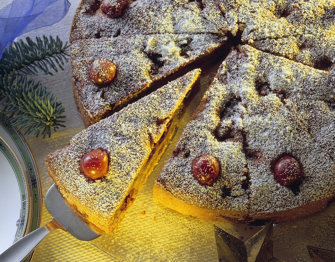 Chestnut and cherry cake with icing sugar