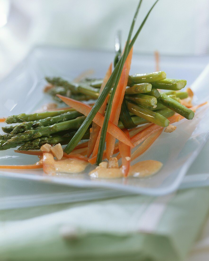 Green asparagus with strips of pepper in bowl