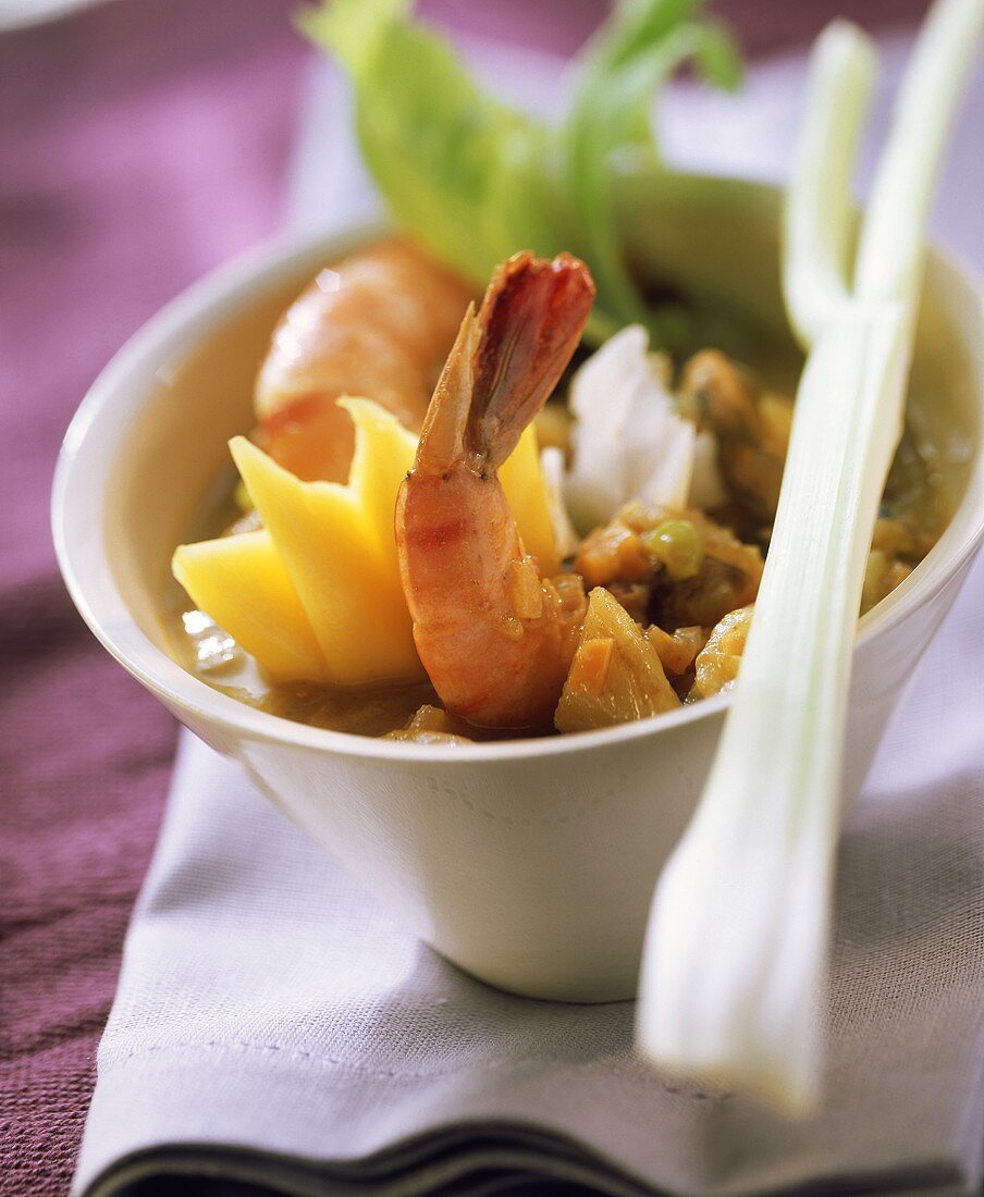 Seafood curry with shrimps and mangoes