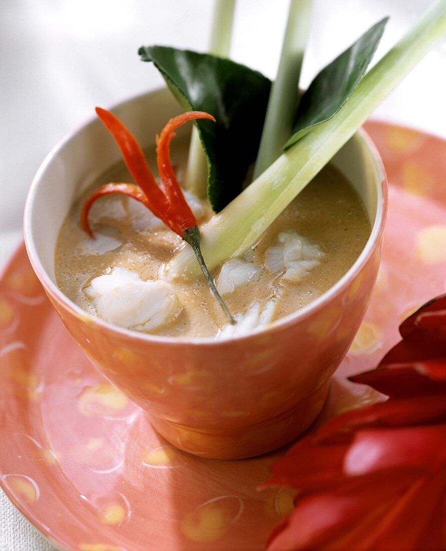 Fish curry with lemon grass and chili pepper in bowl