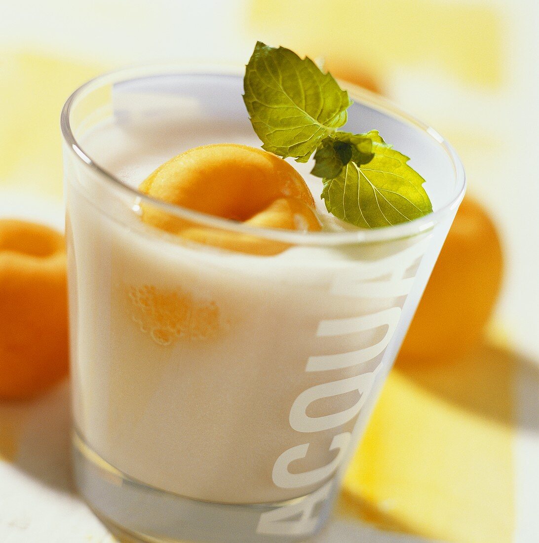 Apricot buttermilk drink with mint leaf