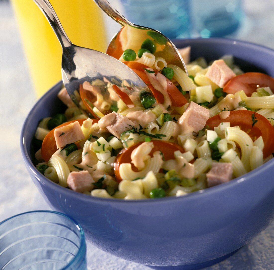 Crescent pasta salad with smoked pork rib, peas and tomatoes