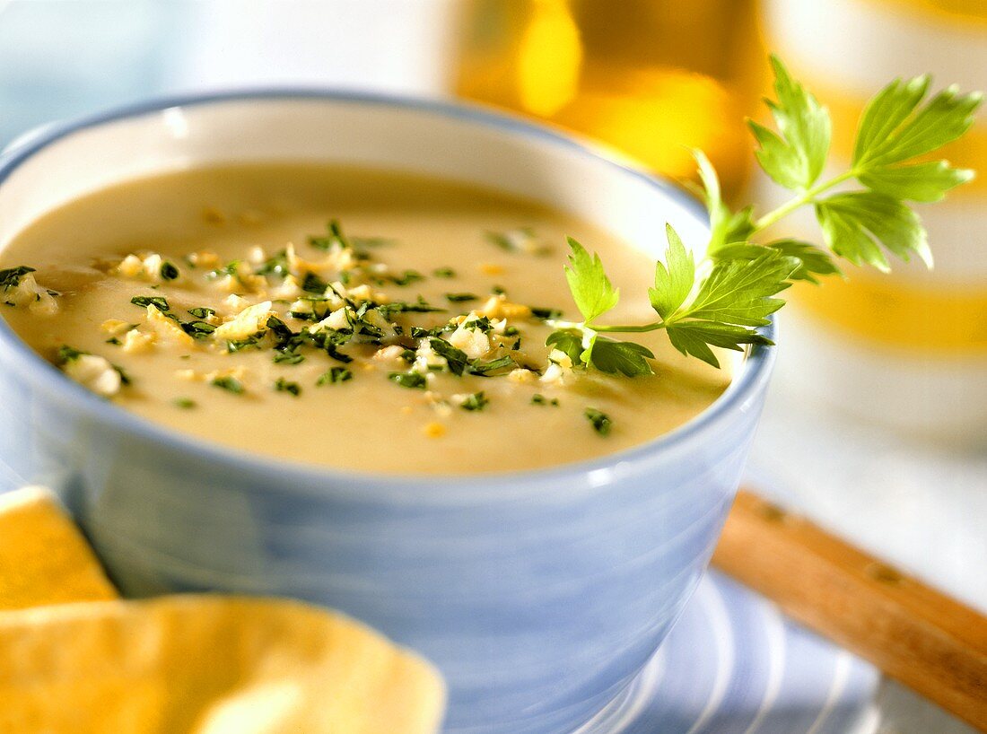 Cream of potato soup with gremolata and parsley