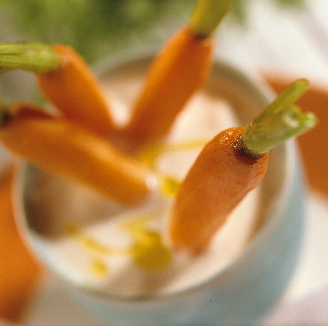 Four fried carrots with sour milk dip