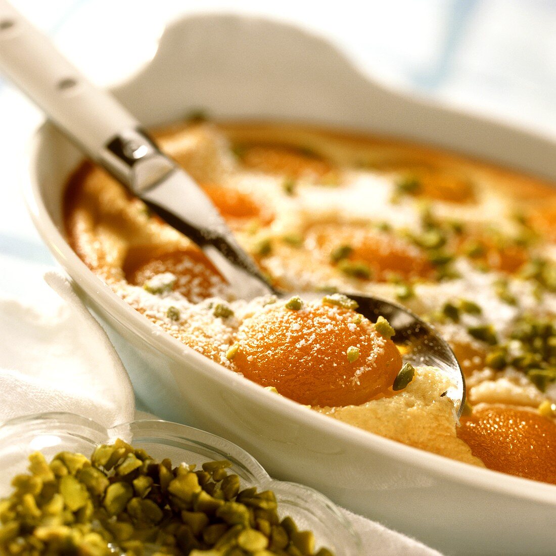 Apricot clafoutis with chopped pistachios