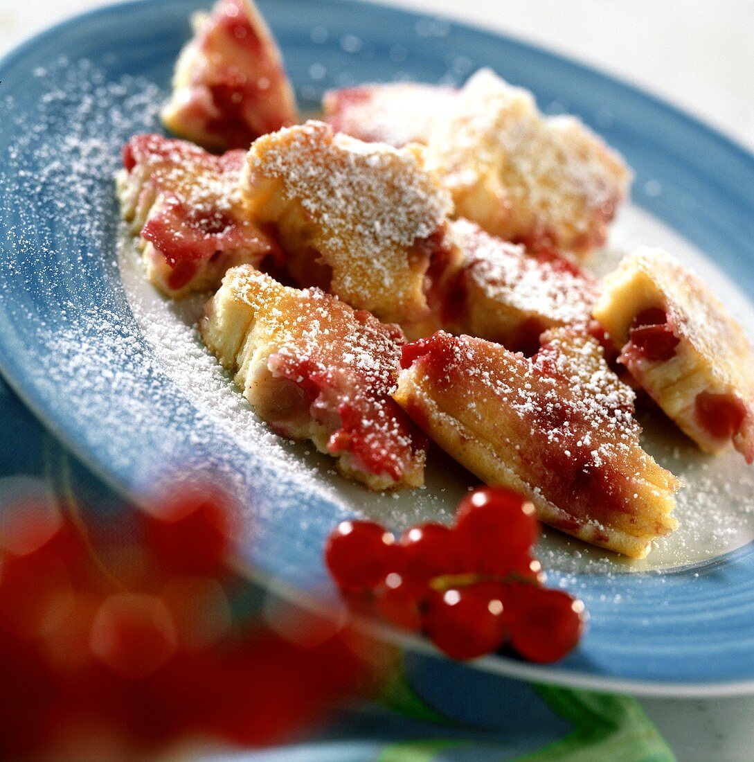 Sweet omelette with redcurrants and quark with icing sugar