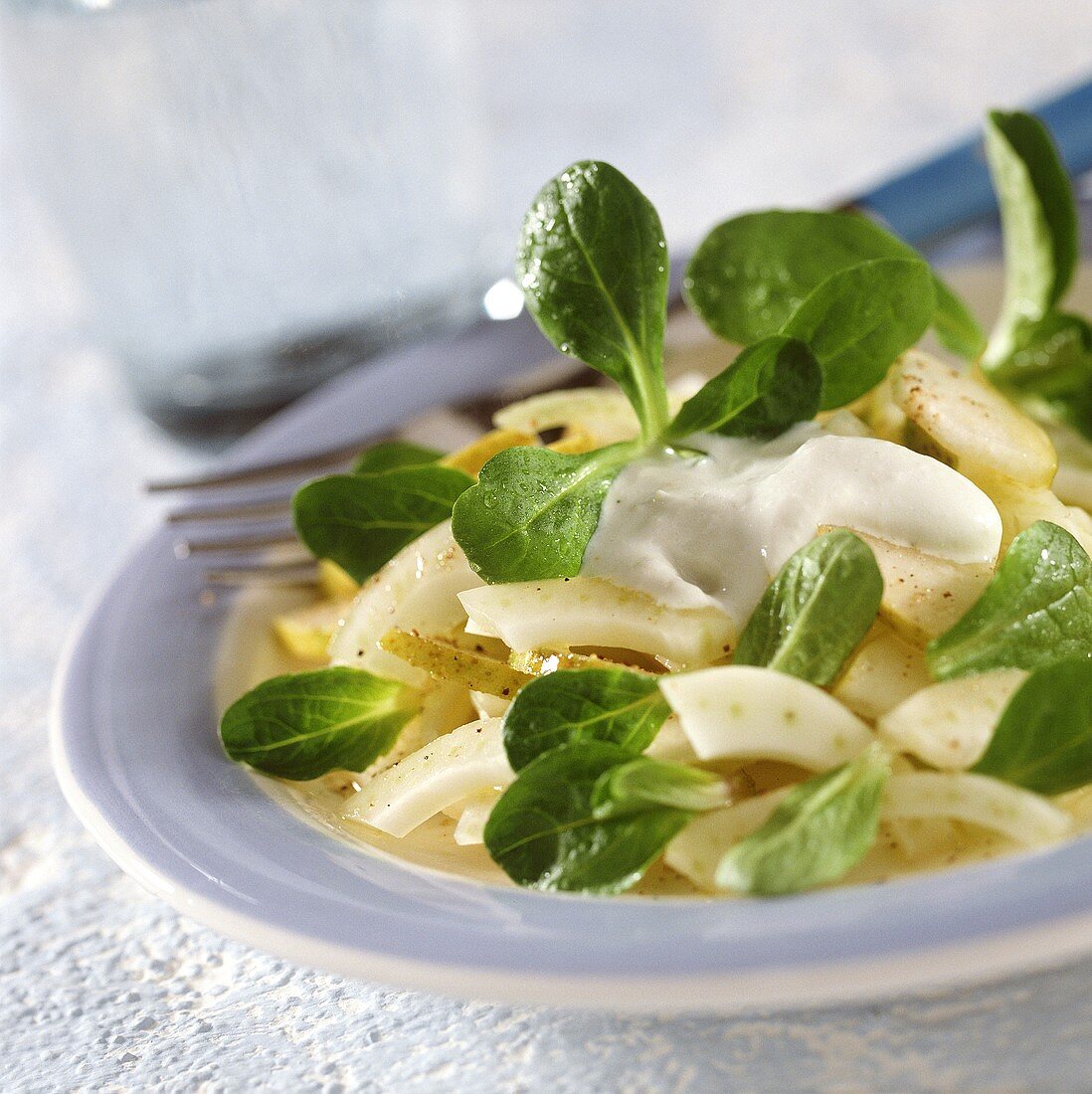 Fennel and pear salad with corn salad and sour cream