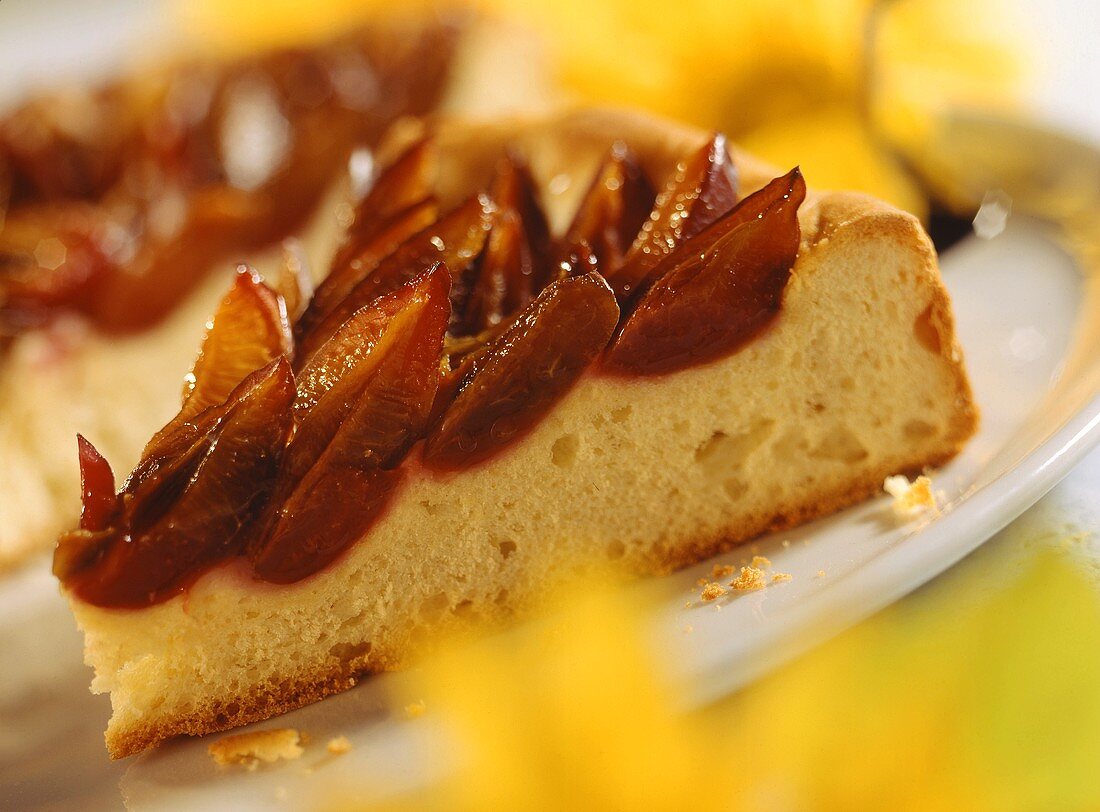 Yeast cake with plums on a plate