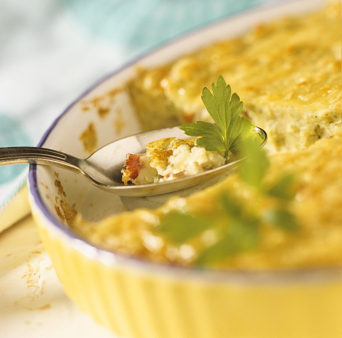 Potato and vegetable tart with parsley in baking dish