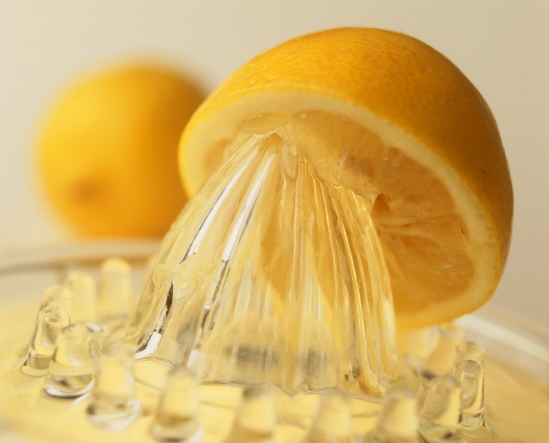 Lemon half on a lemon squeezer