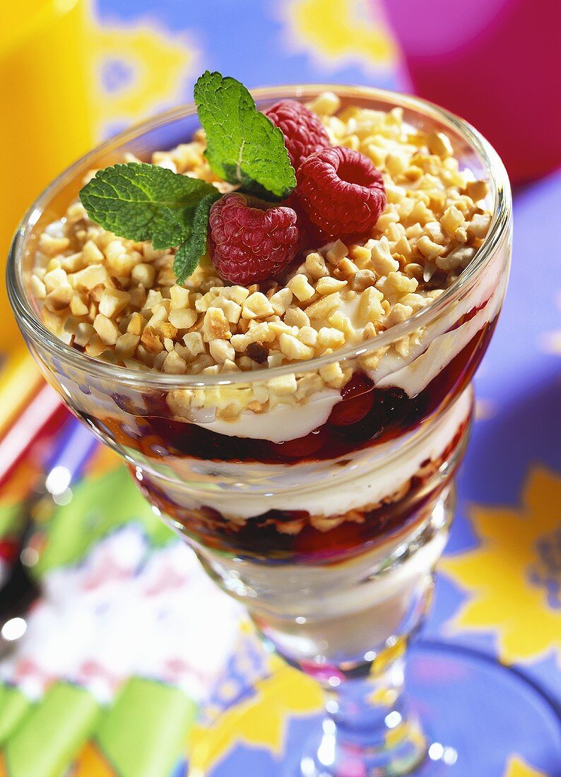 Layered fruit & creamed rice dessert with chopped almonds