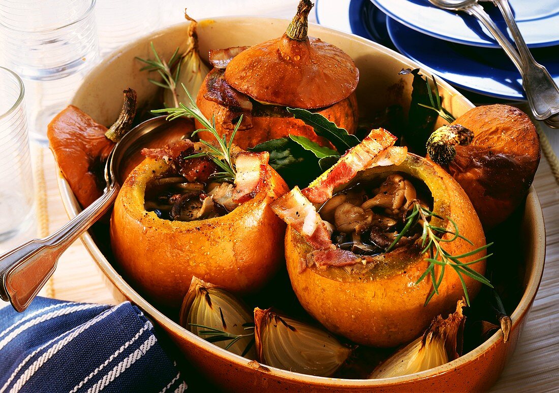 Pumpkin soup with bacon and mushrooms in a pumpkin