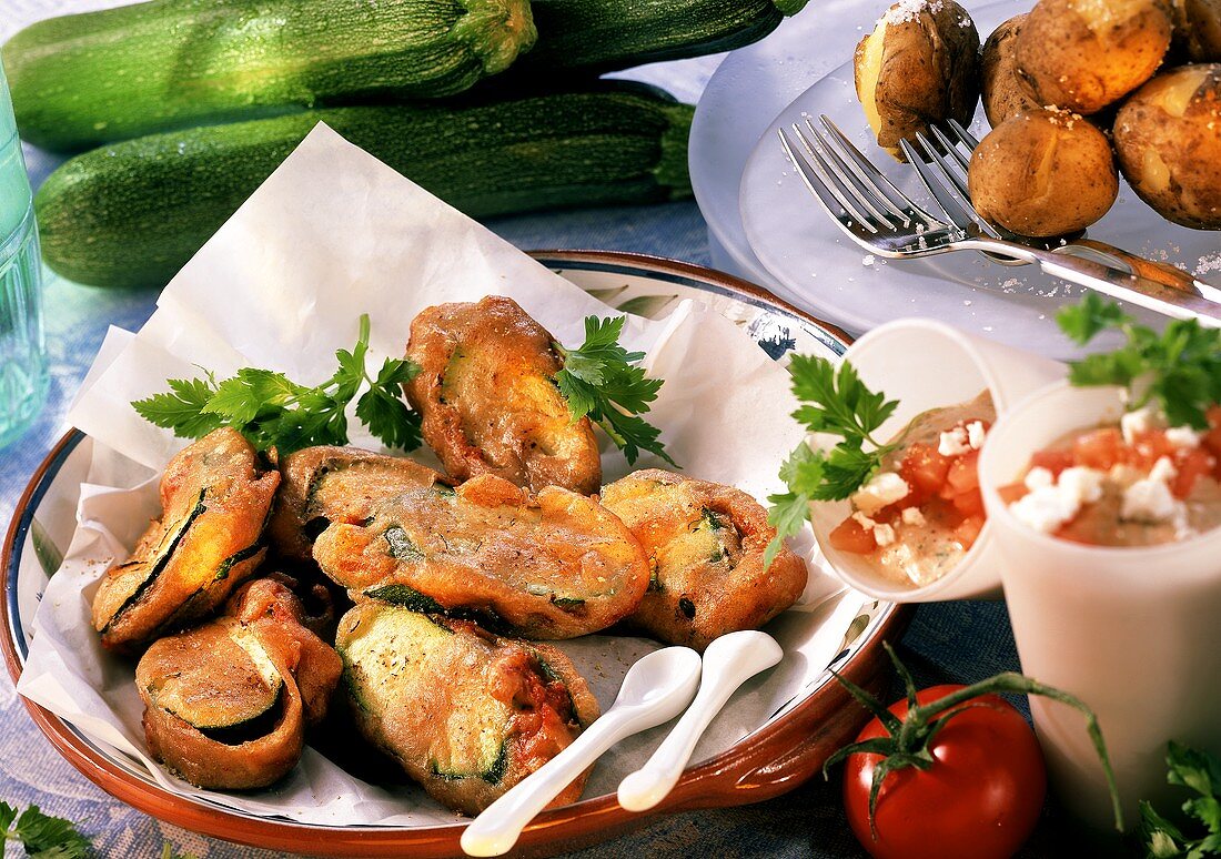 Courgettes with tomato quark in beer batter, boiled potatoes