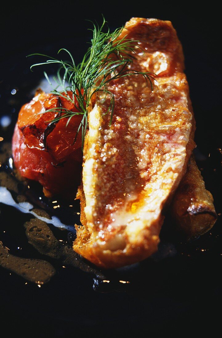 Red mullet fillet with grilled tomato and dill