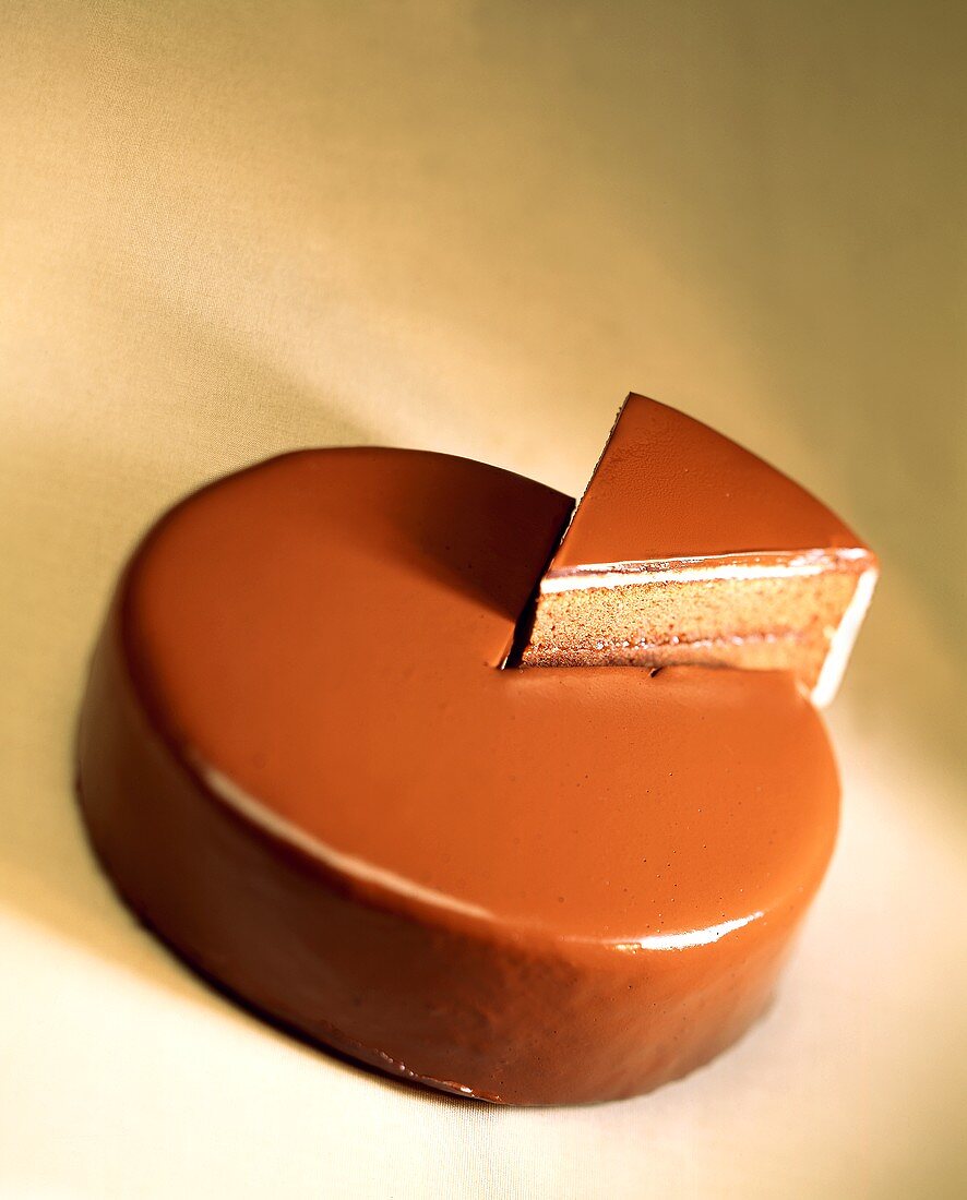 Chocolate cake with piece raised up