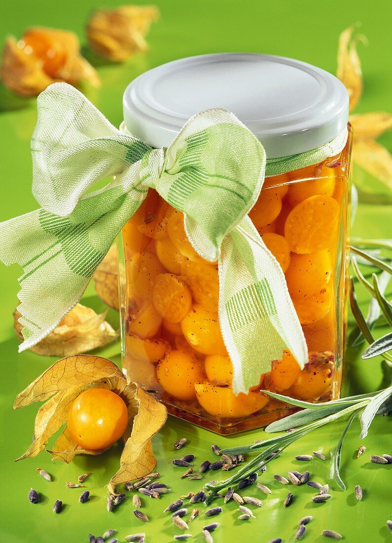 Physalis compote with lavender in jar with green bow
